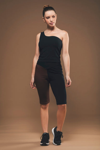 Image of black and brown organic cycling shorts made by Organique, a sustainable clothing brand.